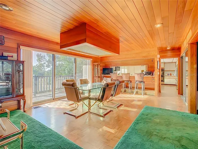 a spacious bedroom with a bed and a couch