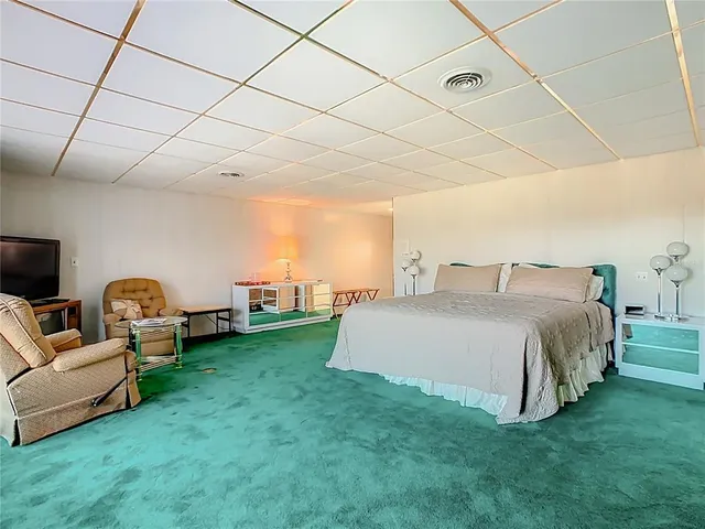 a bathroom with a sink a mirror and a shower