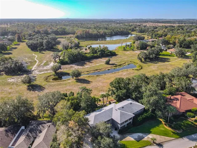 a bed room with a bed and a white kitchen