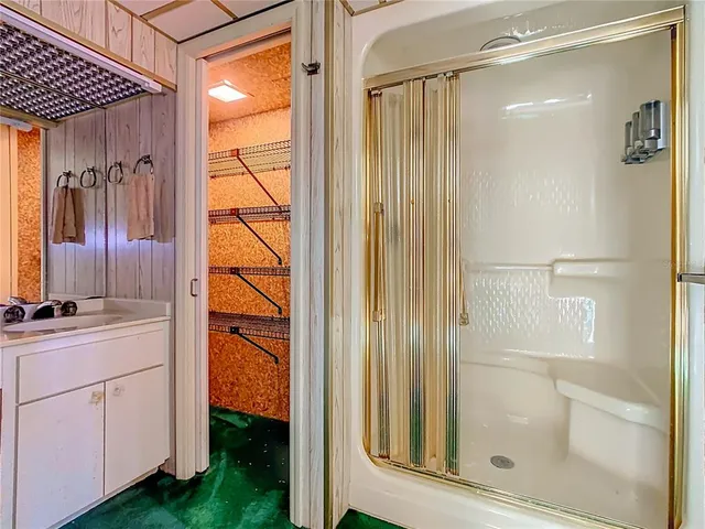 a bed room with a bed and a television