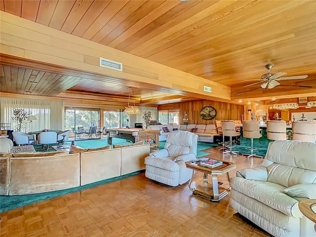 a view of a swimming pool with a table and chairs