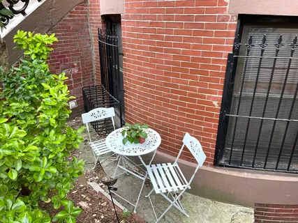 a view of a chairs and table in a patio