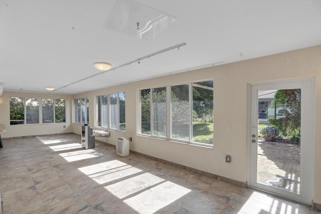1088 Southwest 13th Place Boca Raton, FL 33486 - Photo 20 of 27 Glassed Porch