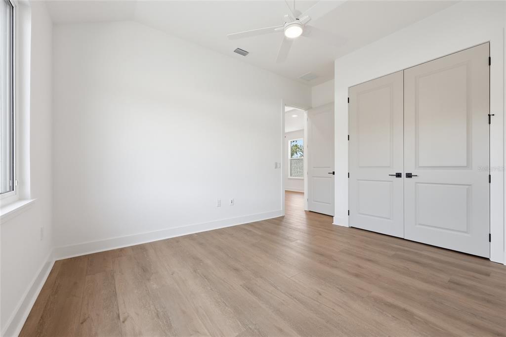 1063 Southwest 135th Way Newberry, FL 32669 - Photo 35 of 42 an empty room with wooden floor