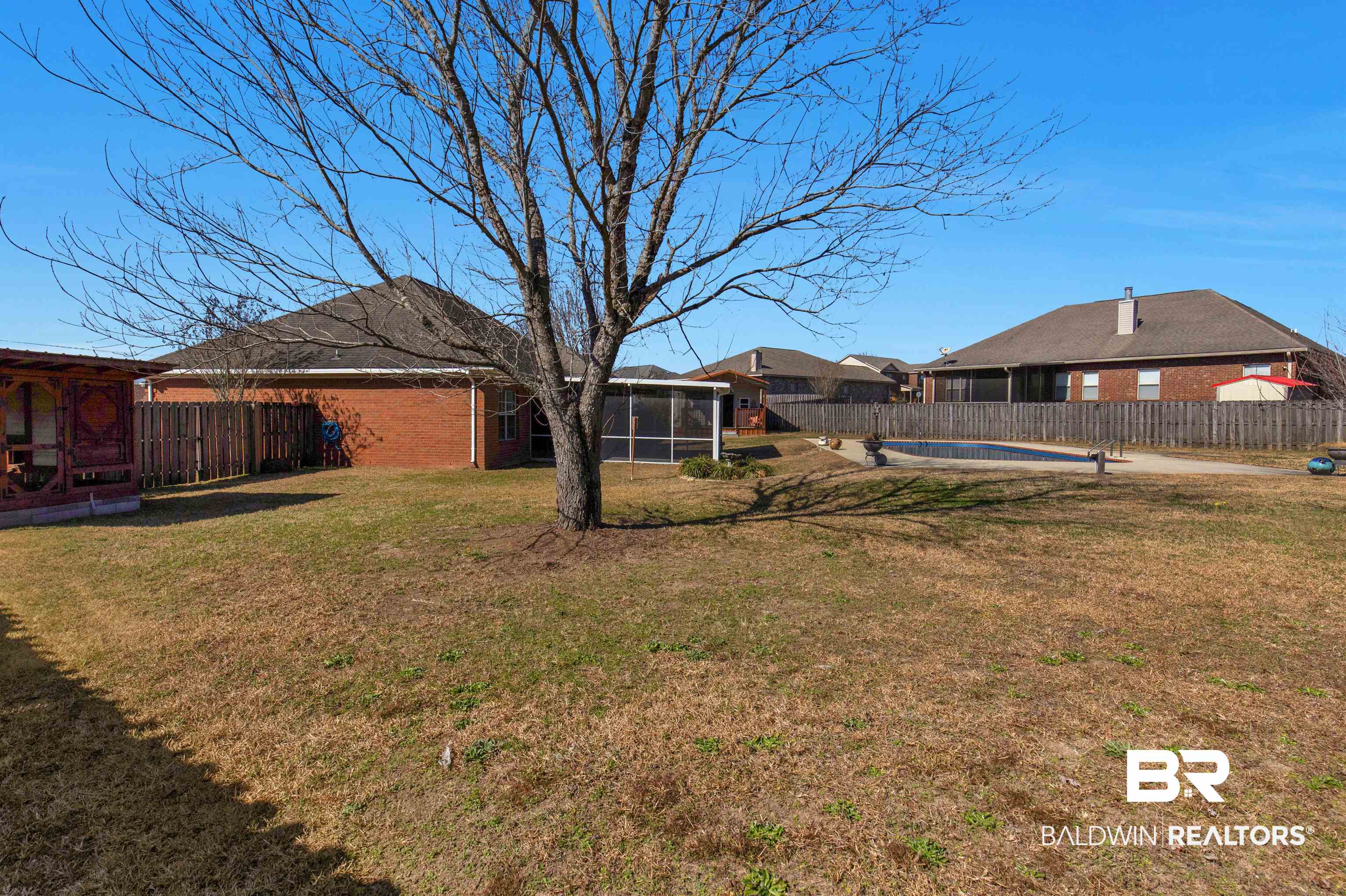 330 Allison Court Mobile, AL 36608 - Photo 23 of 27 View of yard with a sunroom and an empty pool