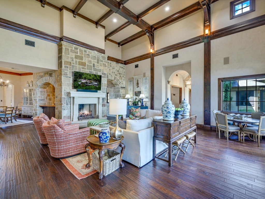 2515 Boot Ranch Circle Fredericksburg, TX 78624 - Photo 11 of 36 a living room with fireplace furniture and a wooden floor