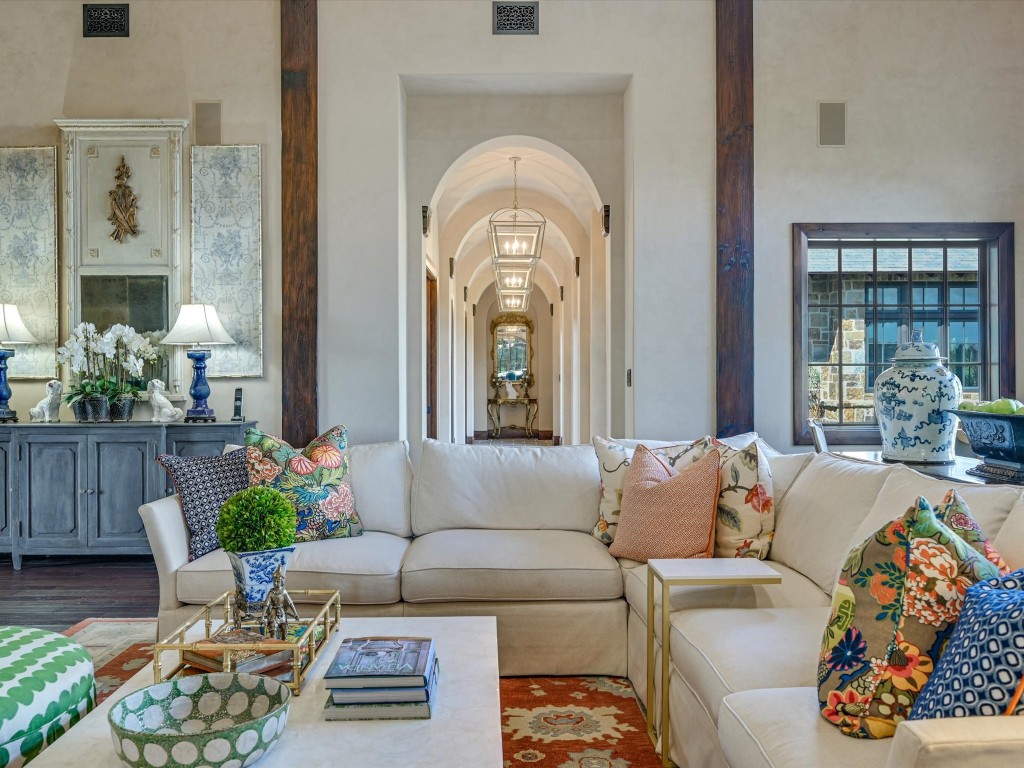 2515 Boot Ranch Circle Fredericksburg, TX 78624 - Photo 12 of 36 a living room with furniture and a large mirror next to a window