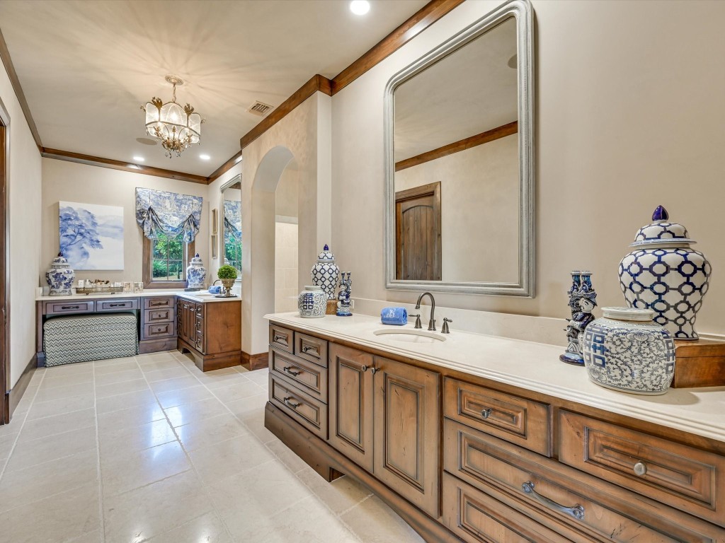 2515 Boot Ranch Circle Fredericksburg, TX 78624 - Photo 16 of 36 a spacious en suite bathroom with double vanity and a mirror