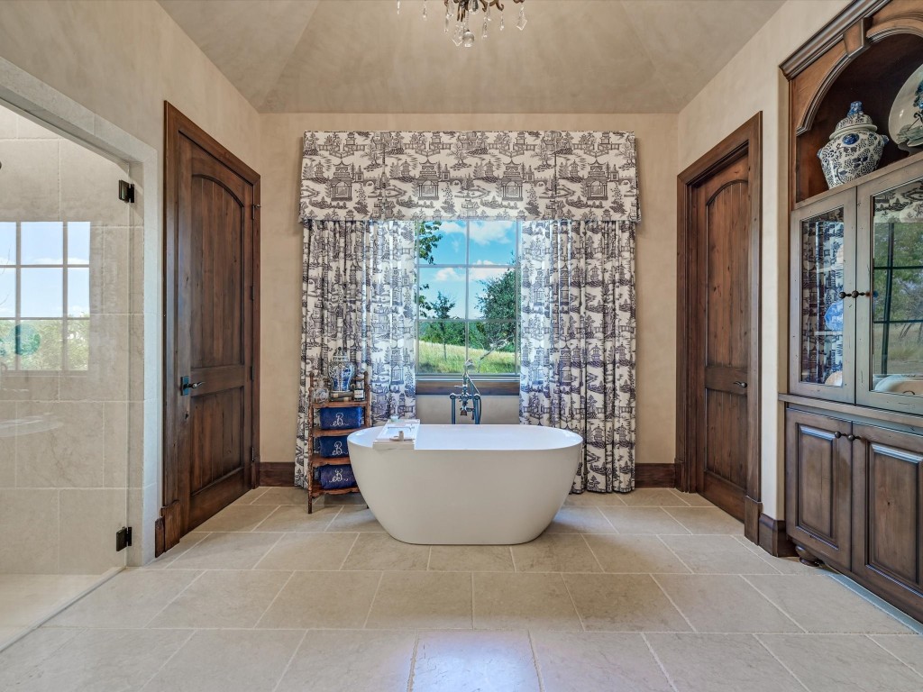 2515 Boot Ranch Circle Fredericksburg, TX 78624 - Photo 17 of 36 a spacious bathroom with a bathtub and shower