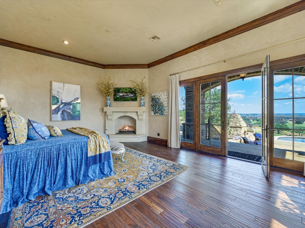 2515 Boot Ranch Circle Fredericksburg, TX 78624 - Photo 20 of 36 a living room with furniture and a fireplace