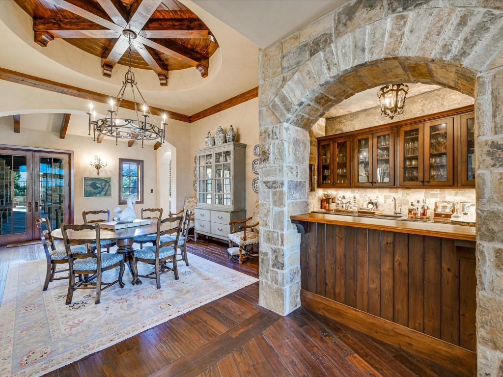 2515 Boot Ranch Circle Fredericksburg, TX 78624 - Photo 21 of 36 a view of a dining room with furniture window and wooden floor