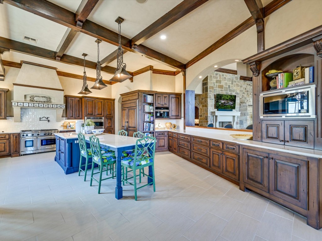 2515 Boot Ranch Circle Fredericksburg, TX 78624 - Photo 25 of 36 a large kitchen with a table and chairs
