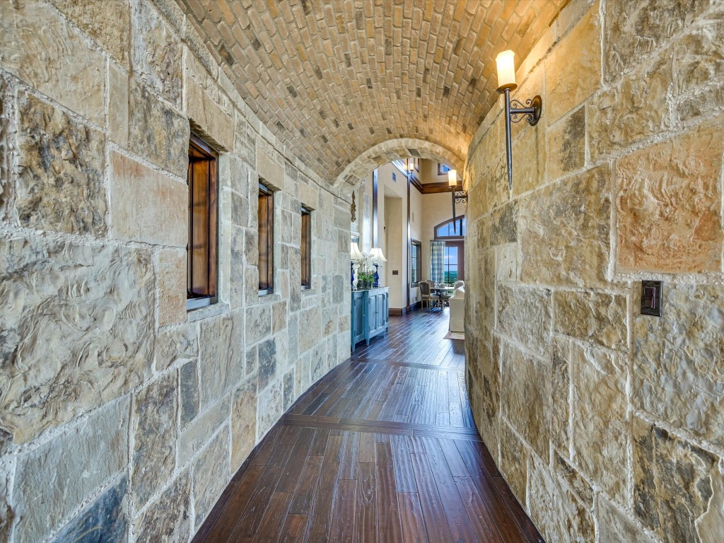 2515 Boot Ranch Circle Fredericksburg, TX 78624 - Photo 9 of 36 a hallway with wooden floor