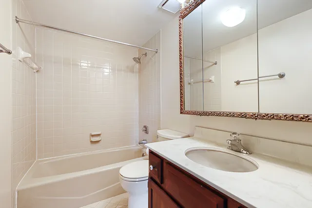 a bathroom with a sink a toilet and a bathtub
