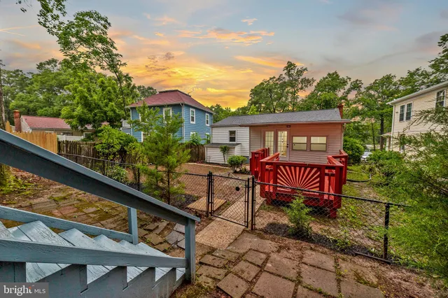 a view of a chair and tables in the balcony