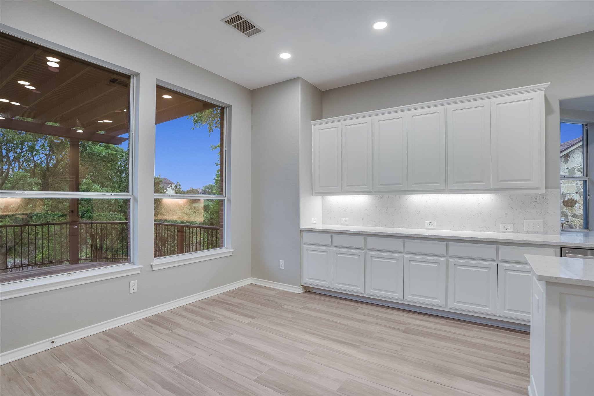1400 Tom Sawyer Road Austin, TX 78737 - Photo 14 of 40 Casual dining area with backyard views and easy access to outdoor living.
