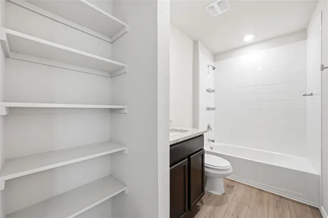 a bathroom with a toilet a sink and bathtub