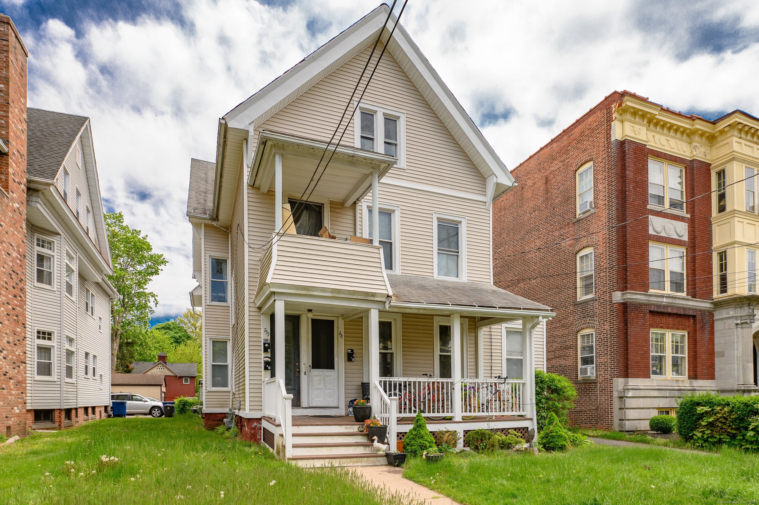 751 Orange Street New Haven, CT 06511 - Photo 1 of 18 a front view of a house with a garden