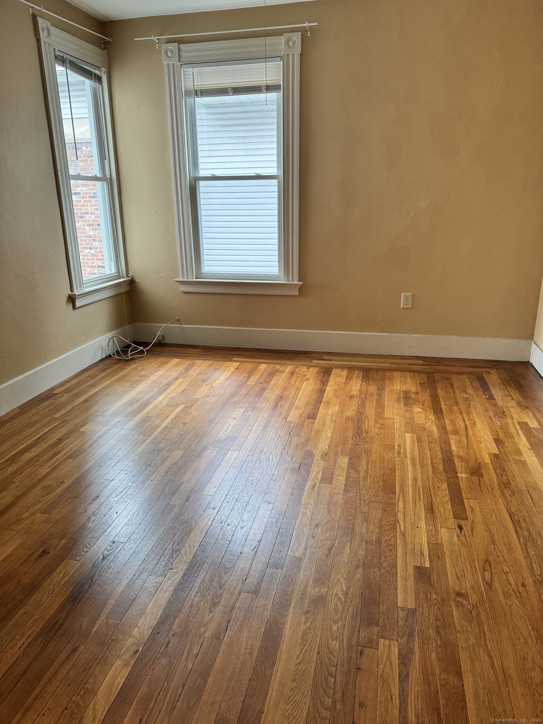751 Orange Street New Haven, CT 06511 - Photo 12 of 18 a view of an empty room and wooden floor and a window