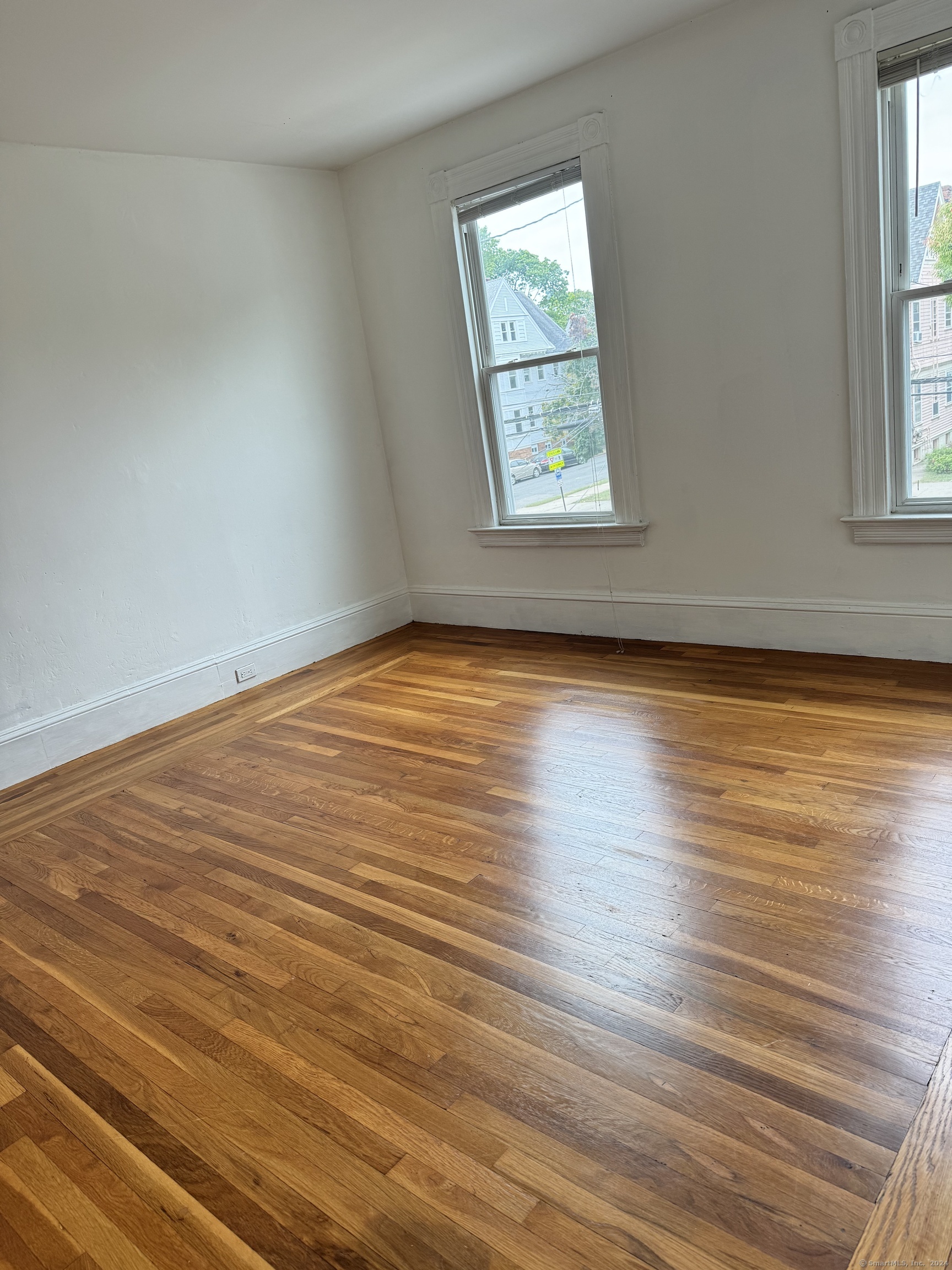 751 Orange Street New Haven, CT 06511 - Photo 13 of 18 an empty room with wooden floor and windows