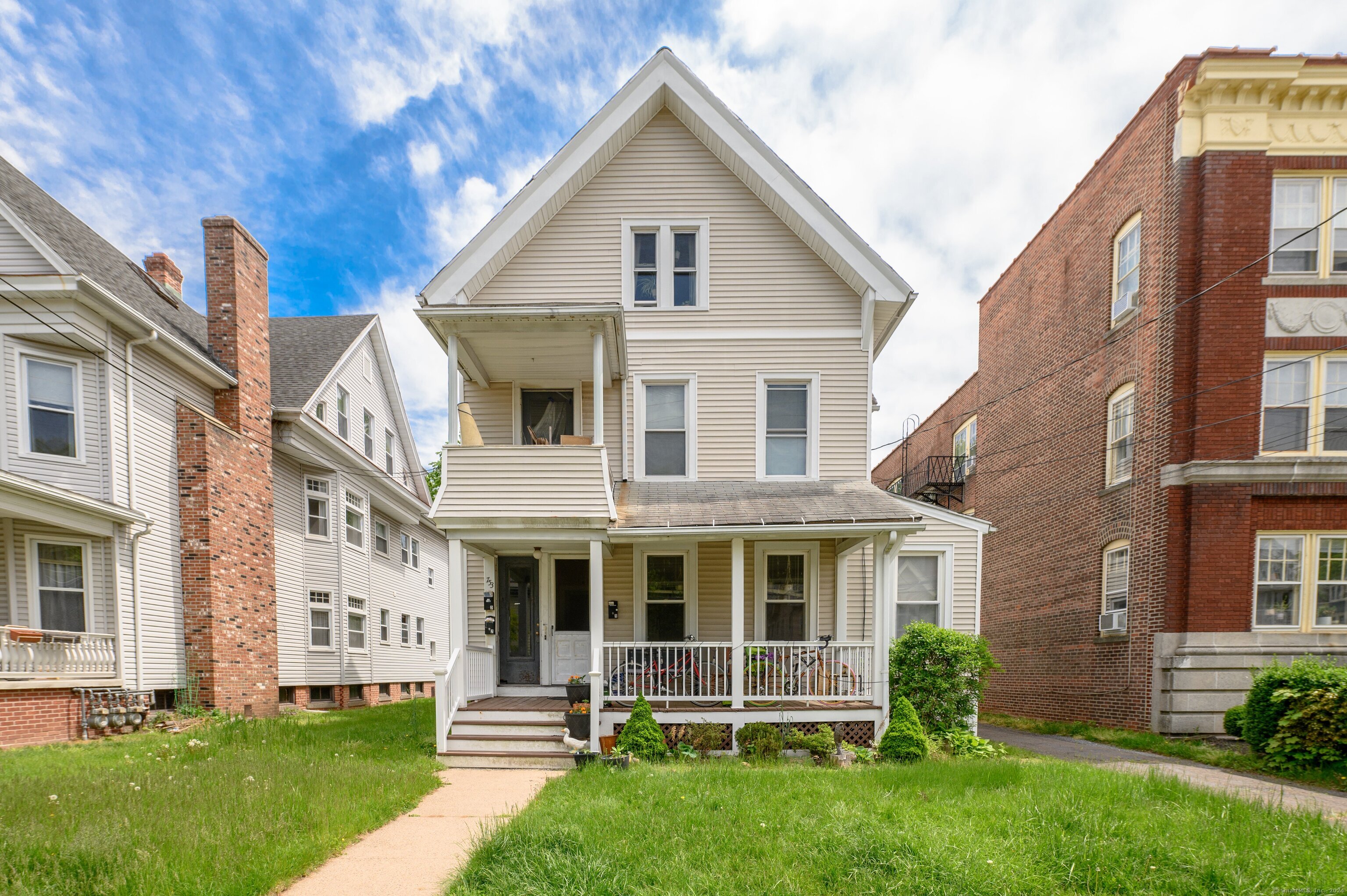 751 Orange Street New Haven, CT 06511 - Photo 2 of 18 a front view of a house with a yard
