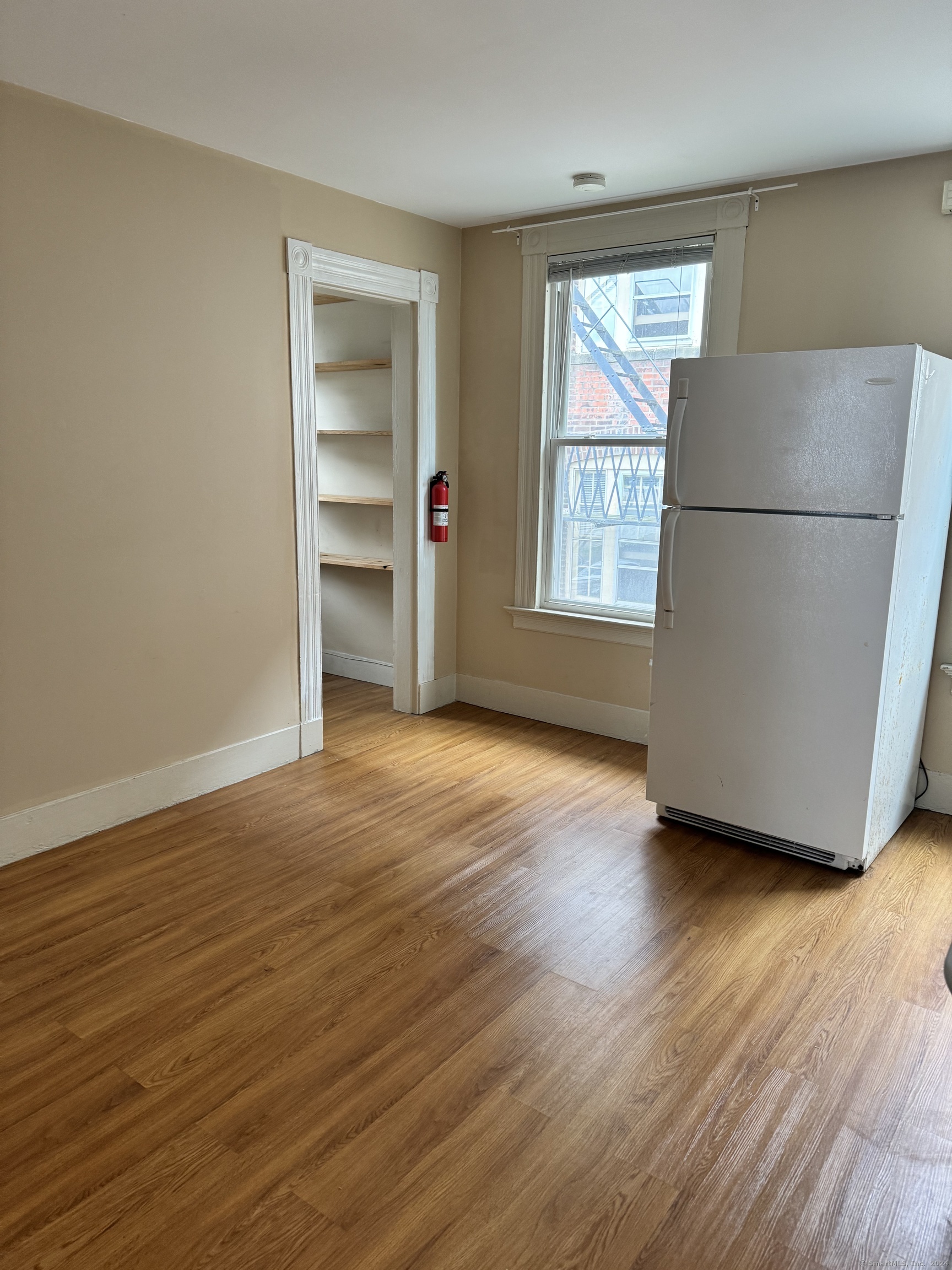751 Orange Street New Haven, CT 06511 - Photo 8 of 18 a view of empty room with wooden floor and fan