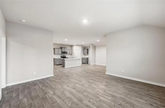 a view of kitchen with wooden floor