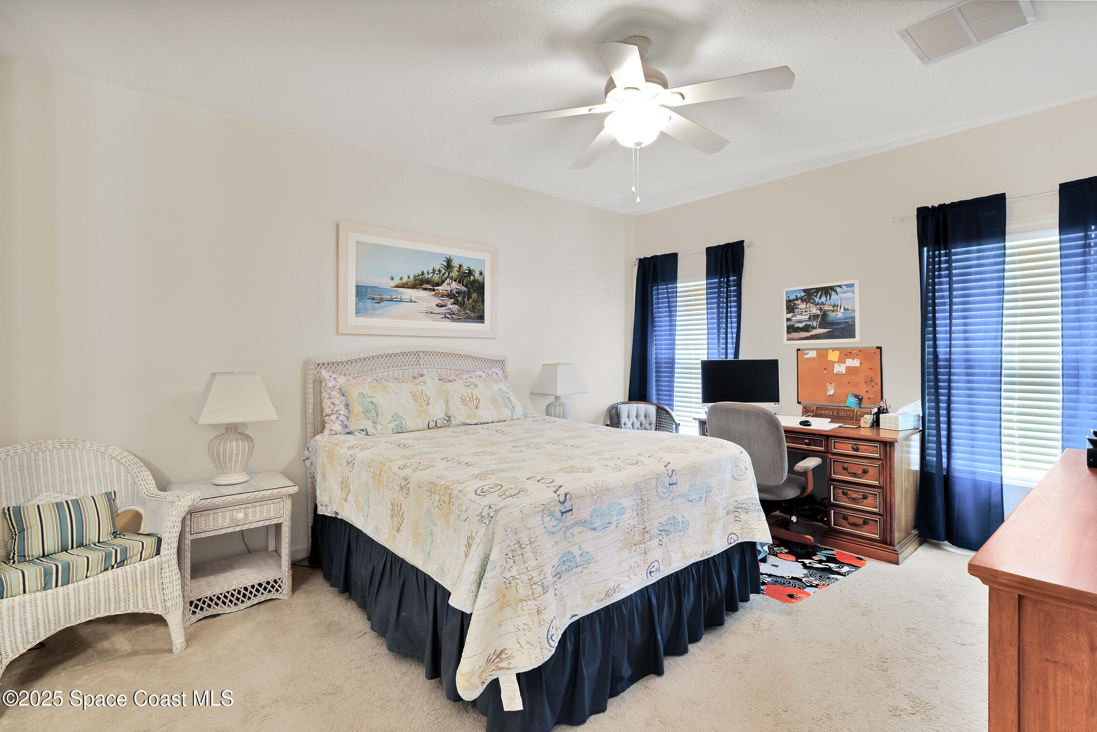 237 Briarcliff Circle Sebastian, FL 32958 - Photo 14 of 43 a bedroom with a bed and a chandelier