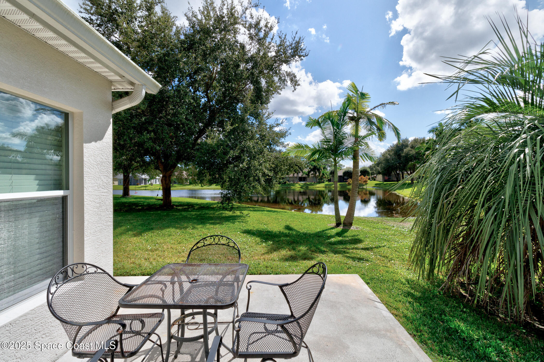237 Briarcliff Circle Sebastian, FL 32958 - Photo 24 of 43 a view of a chair and table in backyard of the house