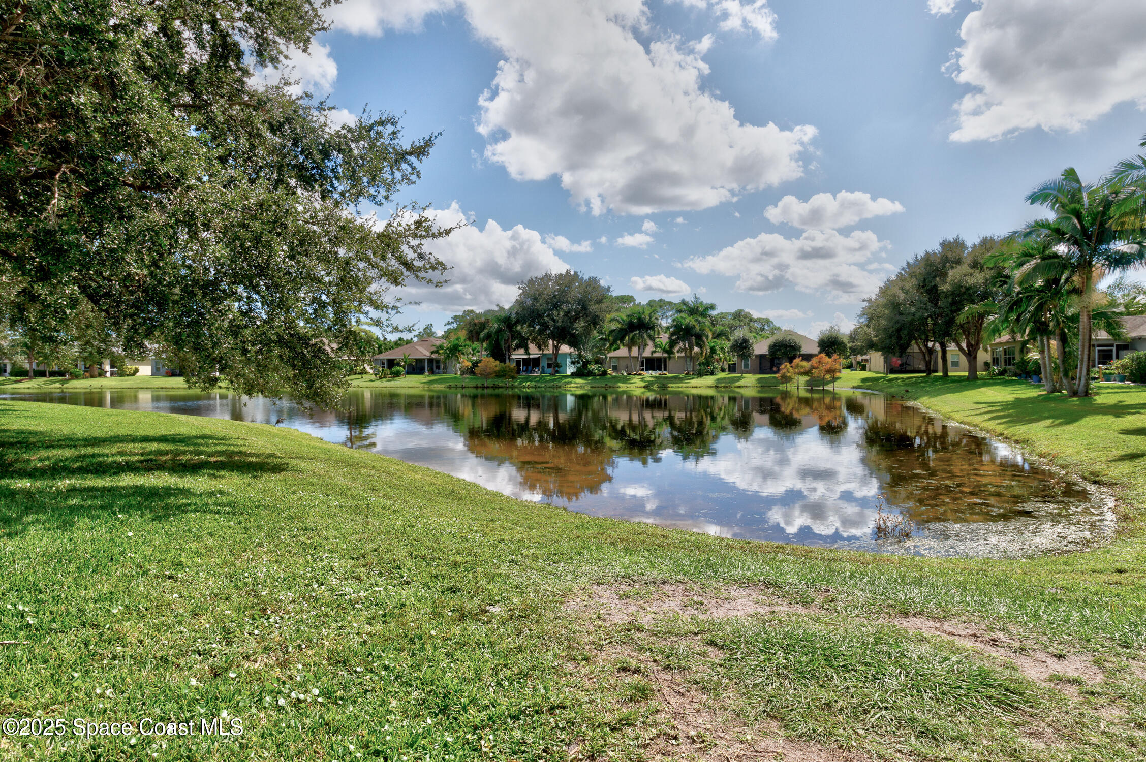 237 Briarcliff Circle Sebastian, FL 32958 - Photo 25 of 43 a view of a lake with houses in background
