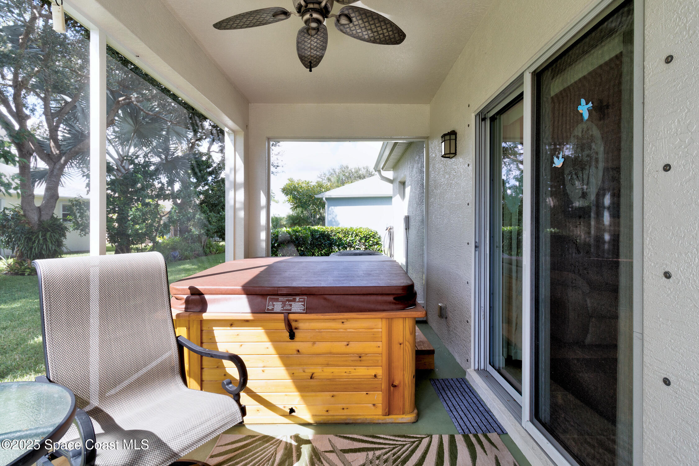 237 Briarcliff Circle Sebastian, FL 32958 - Photo 27 of 43 a view of a balcony dining table and chairs with wooden floor