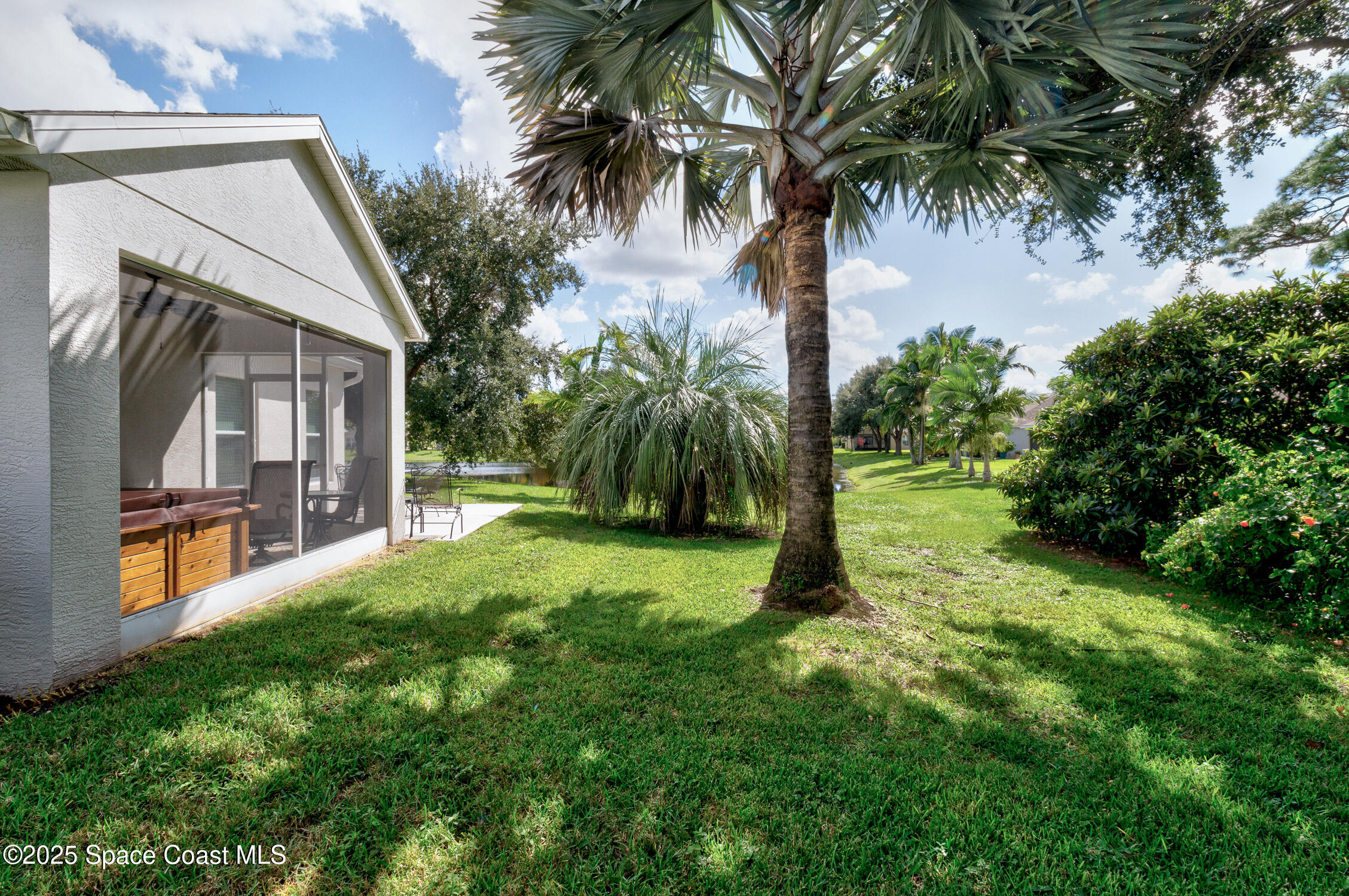 237 Briarcliff Circle Sebastian, FL 32958 - Photo 32 of 43 a yellow house with a yard and palm trees