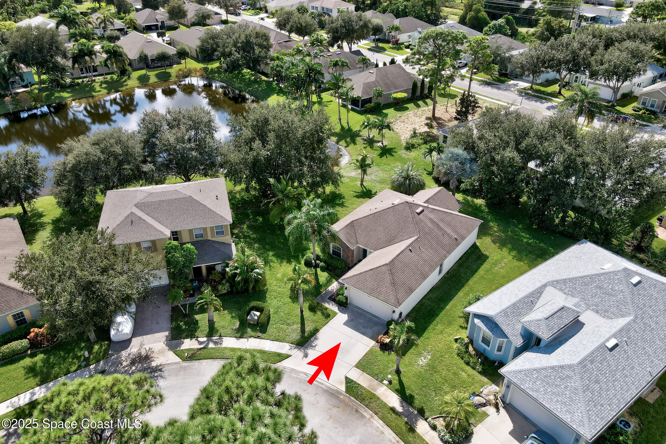 237 Briarcliff Circle Sebastian, FL 32958 - Photo 39 of 43 an aerial view of a house with a yard and lake