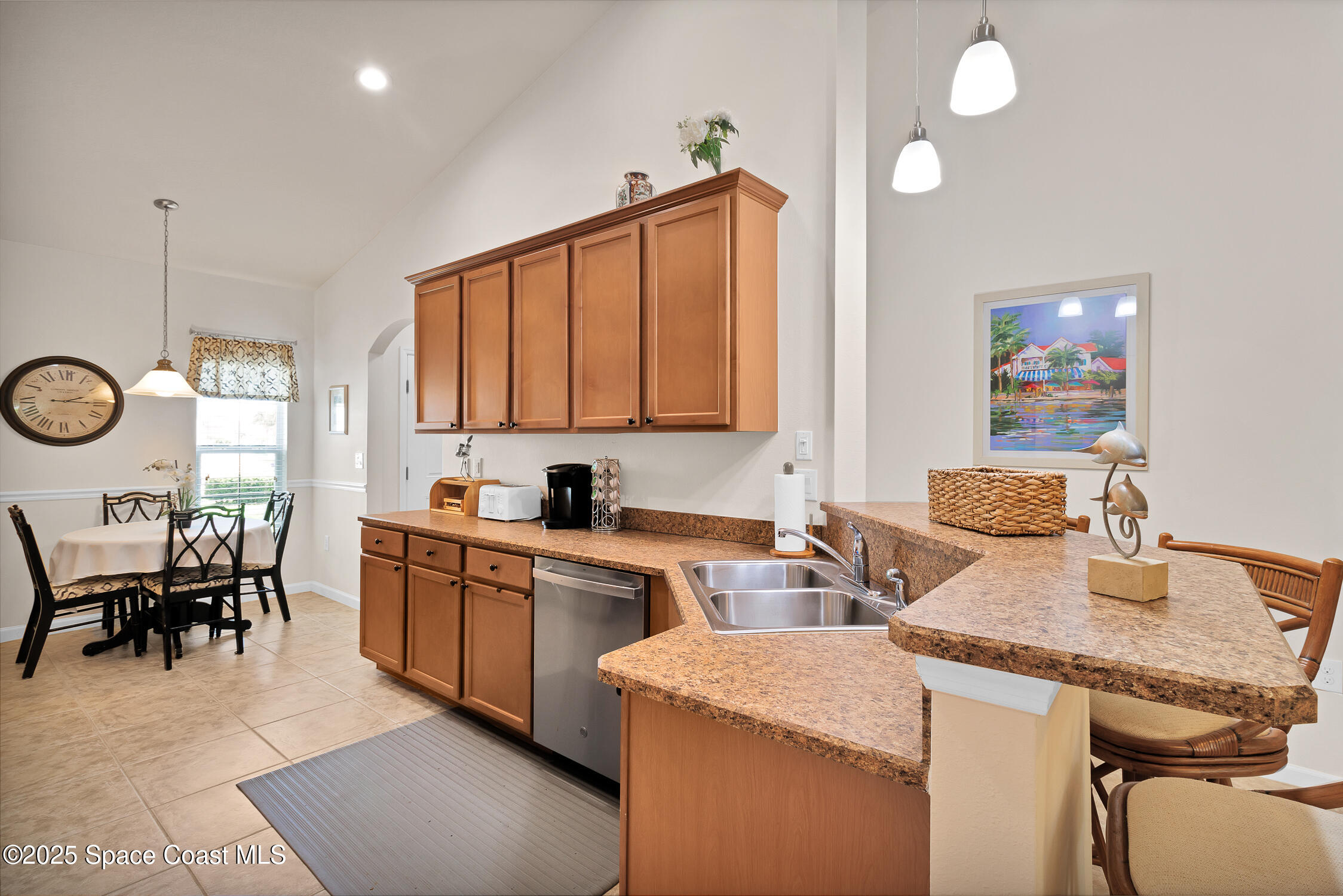 237 Briarcliff Circle Sebastian, FL 32958 - Photo 9 of 43 a kitchen that has a sink and a stove in it