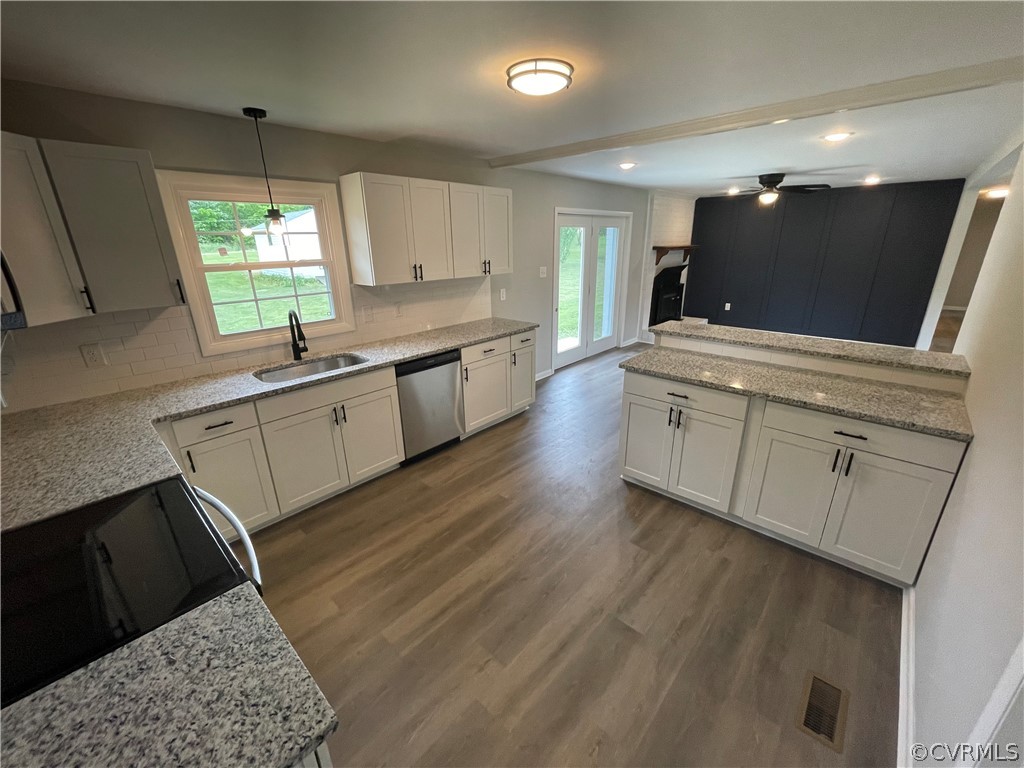 2731 Kinvan Road Henrico, VA 23231 - Photo 11 of 27 a large kitchen with stainless steel appliances kitchen island granite countertop a sink and a stove top oven