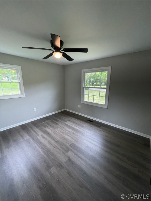 2731 Kinvan Road Henrico, VA 23231 - Photo 18 of 27 wooden floor in an empty room with a window