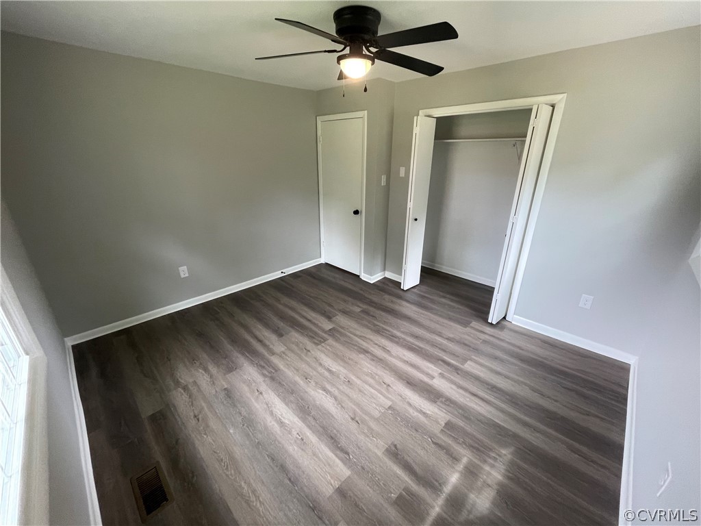 2731 Kinvan Road Henrico, VA 23231 - Photo 19 of 27 wooden floor in an empty room with a window