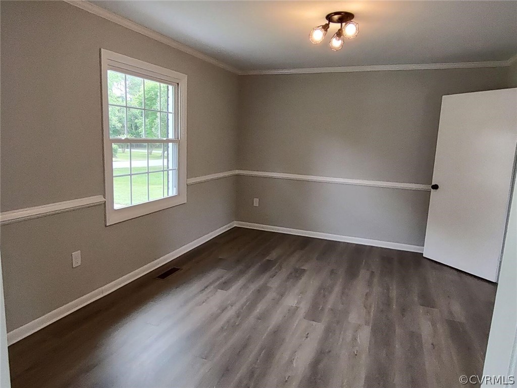 2731 Kinvan Road Henrico, VA 23231 - Photo 26 of 27 an empty room with wooden floor and windows