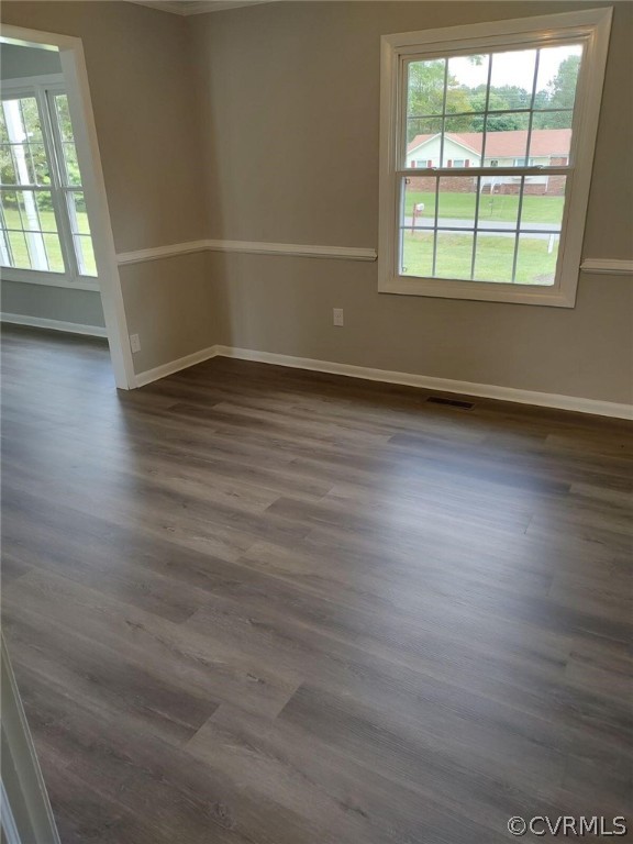 2731 Kinvan Road Henrico, VA 23231 - Photo 27 of 27 an empty room with wooden floor and windows