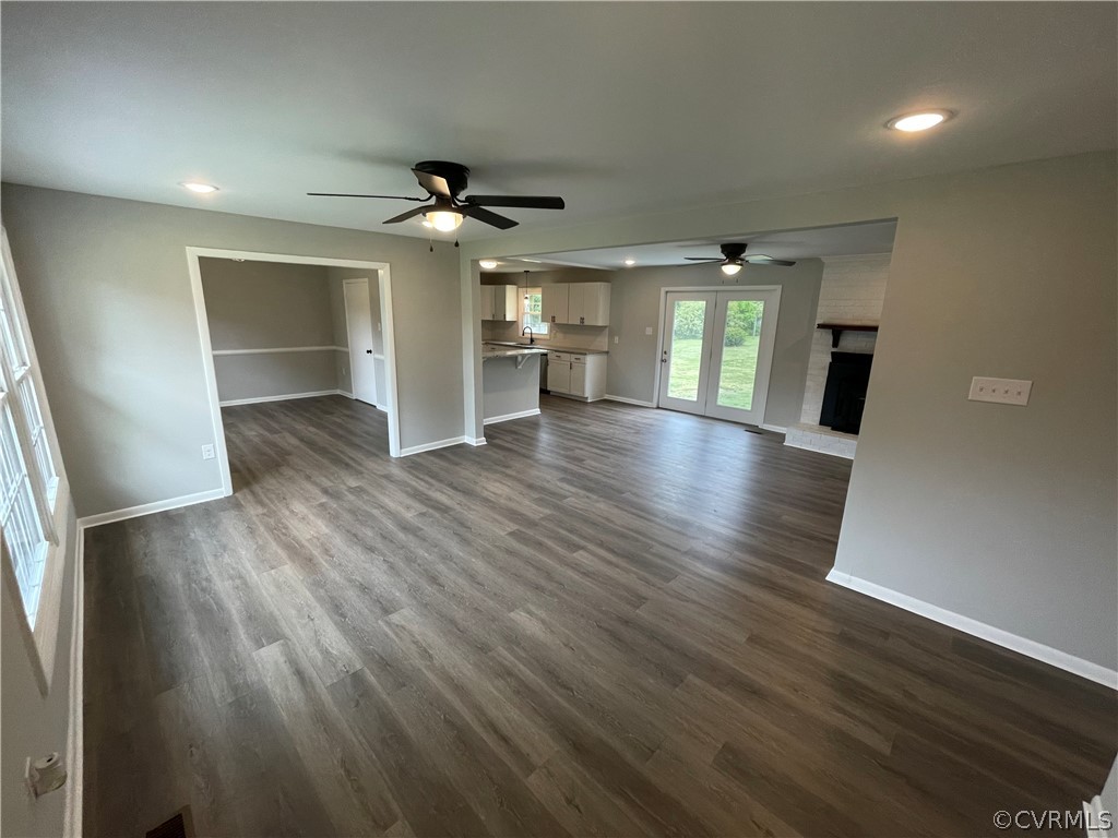 2731 Kinvan Road Henrico, VA 23231 - Photo 5 of 27 an empty room with wooden floor and windows
