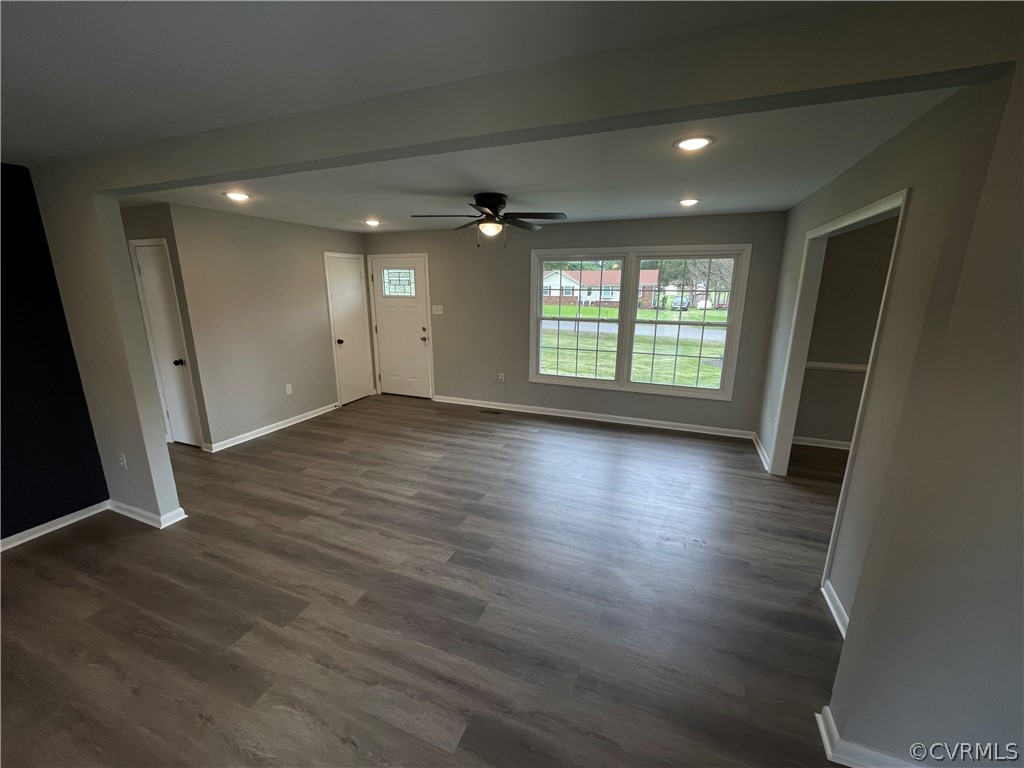 2731 Kinvan Road Henrico, VA 23231 - Photo 6 of 27 an empty room with wooden floor and windows