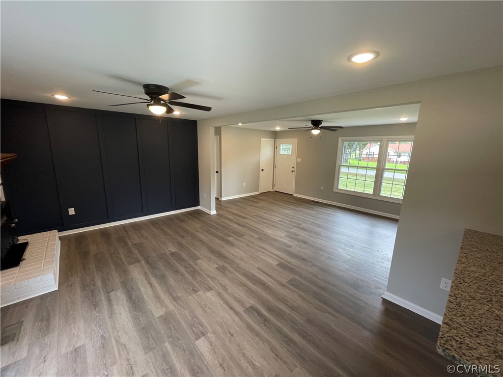 2731 Kinvan Road Henrico, VA 23231 - Photo 8 of 27 an empty room with wooden floor and windows