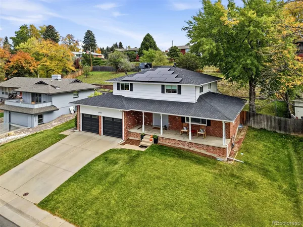 an aerial view of a house with a yard