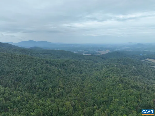 a aerial view of a house with a yard
