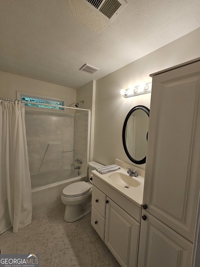 65 Tralee Trace Sharpsburg, GA 30277 - Photo 13 of 21 a bathroom with a granite countertop toilet a sink and a mirror