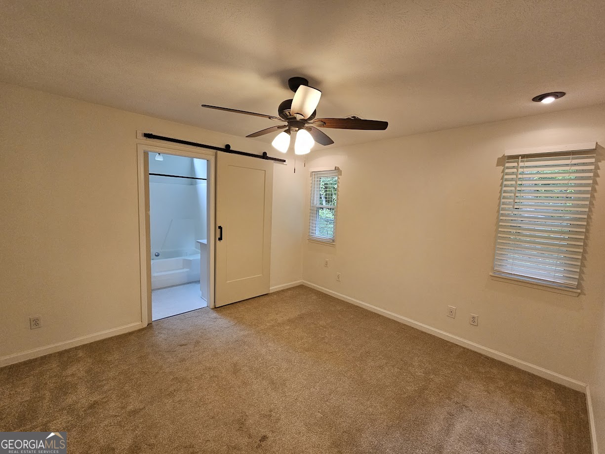 65 Tralee Trace Sharpsburg, GA 30277 - Photo 14 of 21 a view of an empty room with a window
