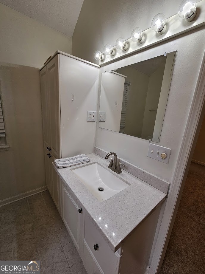 65 Tralee Trace Sharpsburg, GA 30277 - Photo 16 of 21 a bathroom with a sink and mirror