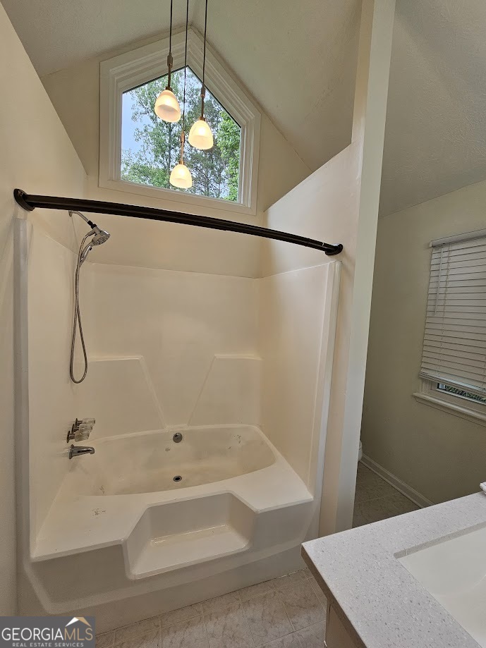 65 Tralee Trace Sharpsburg, GA 30277 - Photo 17 of 21 a bathroom with a bath tub and a shower