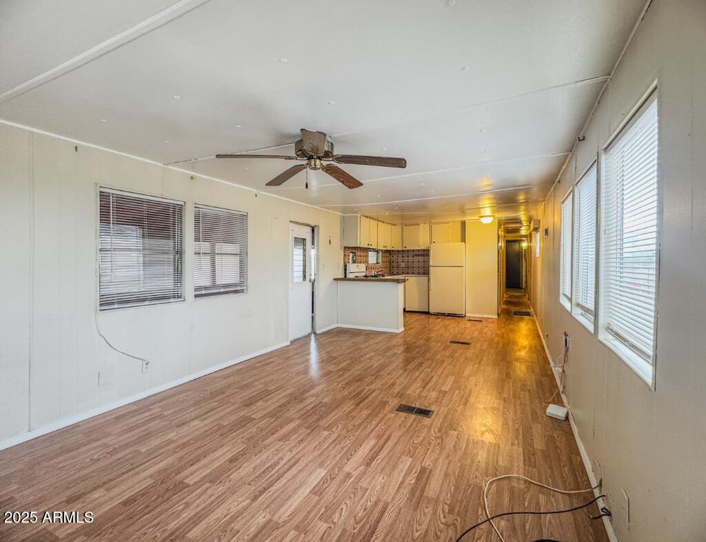 11100 West Alsdorf Road, Unit 10 Arizona City, AZ 85123 - Photo 11 of 19 a view of a livingroom with wooden floor