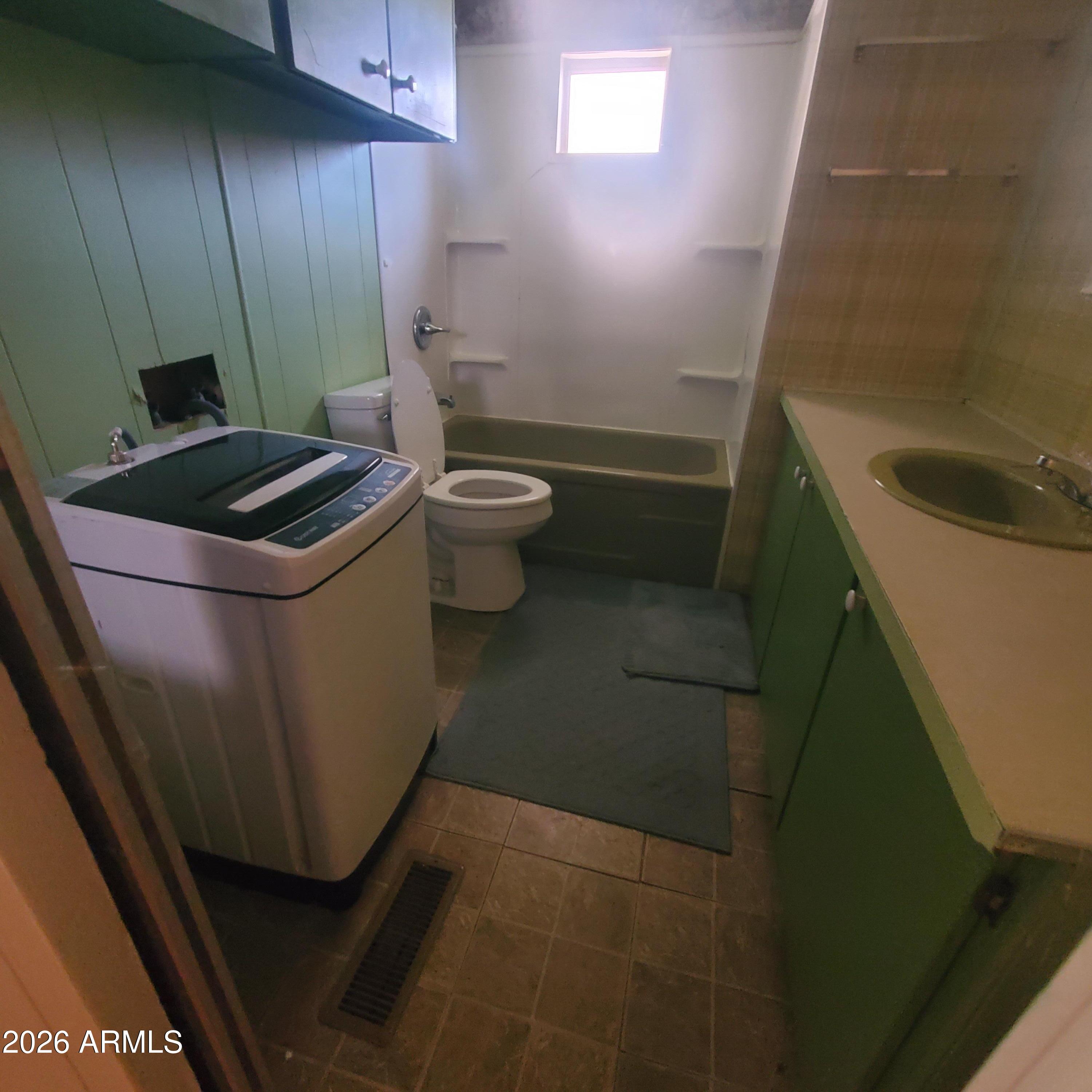 11100 West Alsdorf Road, Unit 10 Arizona City, AZ 85123 - Photo 4 of 19 a bathroom with a sink and toilet